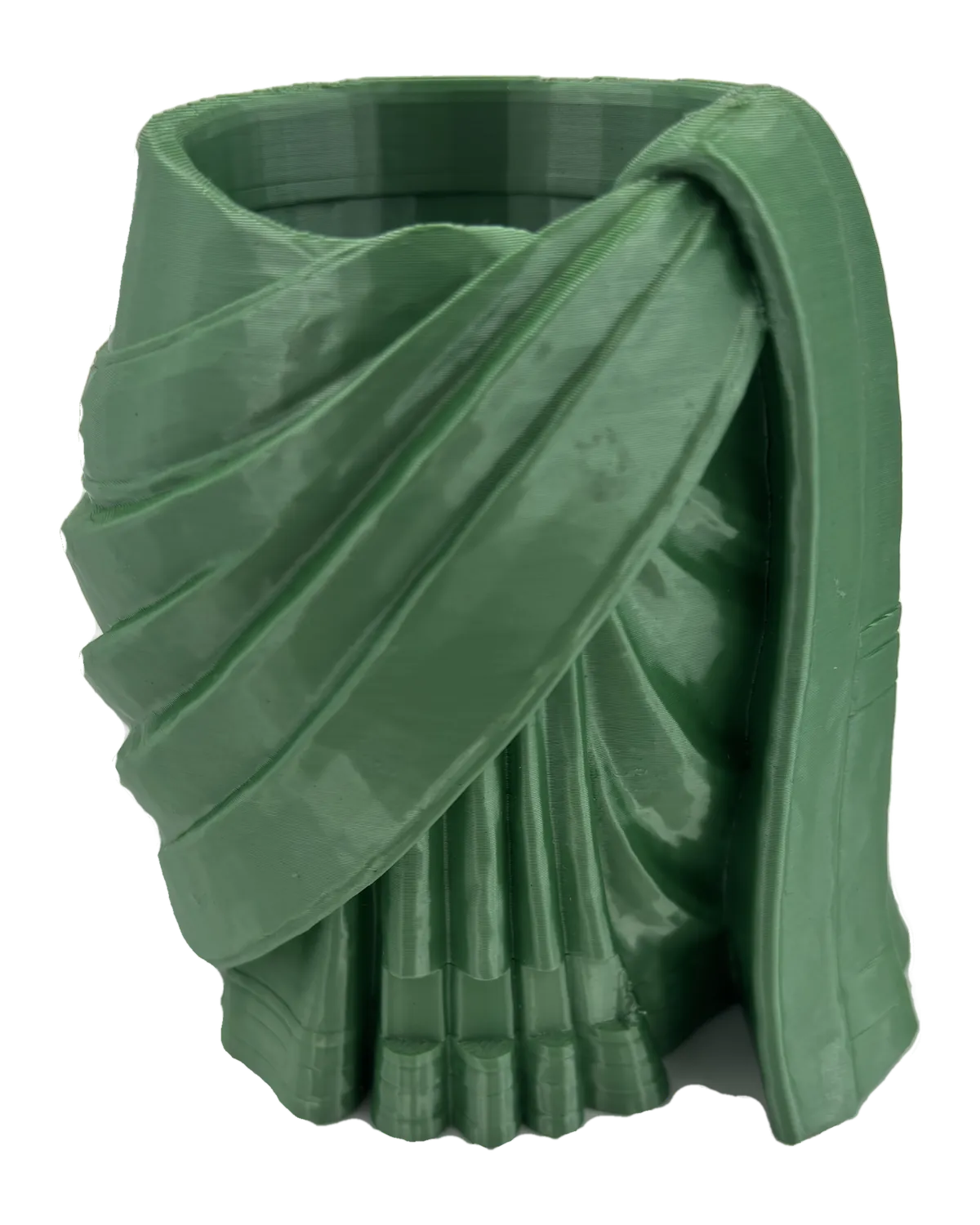 A full-size saree vessel printed in green filament, its pleats and drape carrying the fine horizontal lines left by the printer.